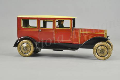 TIPP CO. FOUR DOOR SEDAN: Germany, late 1920's, lithographed tin, done in rich red body, yellow roof, black fenders, seated driver, features two opening rear doors, clockwork driven, appears to have once had windshield; have