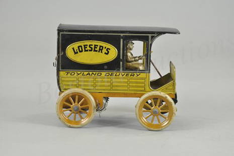 HANS EBERL "LOESERS TOYLAND" DELIVERY VAN: Germany, c. 1920, lithographed tin reads "Toyland Delivery," on sides, opening rear doors, clockwork driven, seated driver, a classic store promotional toy in colorful simulated wood panel litho. 