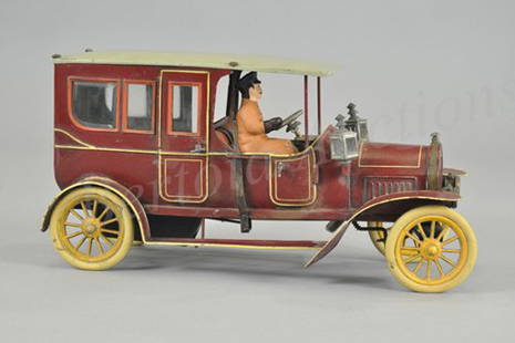 BING LIMOUSINE: Germany, c. 1913, luxury styled saloon with extensive appointments, painted in rich maroon body, features glass windows, embossed seating, rubber tires, spoke wheels, lamps and lanterns, brake lever