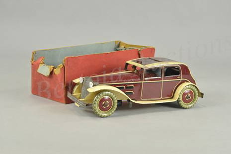 WELLS 'O' LONDON LIMOUSINE: England, c. 1934, lithographed tin, done in rich maroon and yellow, full running boards, electric lights, clockwork driven, nice Deco appearance with sliding roof feature and seated driver, includes