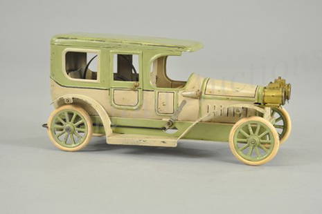 KARL BUB LIMOUSINE: Germany, c. 1920's, repainted in a great color scheme, lithographed tin, done in green and light tan, features head lamps, spoke wheels with rubber tires, clockwork driven. 10 1/4" l.