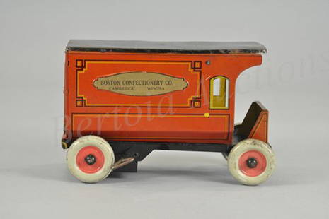 FERDINAND STRAUSS "BOSTON CONFECTIONERY CO." DELI: C. 1913, lithographed tin, advertising appears on embossed side panels, clockwork driven, quite early and true scaled delivery truck. 9 1/4" l.