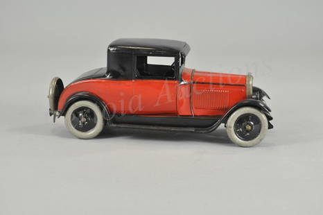 CITROEN CABRIOLET: France, c. 1929, red painted body, black roof and running boards, spare on rear, embossed seating, clockwork mechanism, disc wheels. 12" l.