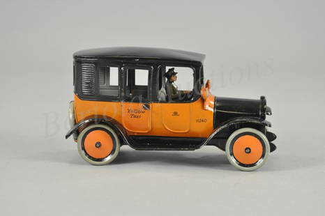 BING YELLOW TAXI: Germany, c. 1920's, lithographed tin, done for the American market in classic orange and black body, colors of famed yellow taxi, spare tabbed to rear, seated driver, clockwork driven. 8 3/4" l.