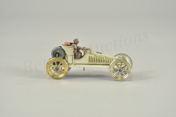 GUNTHERMANN "GORDON BENNETT" RACER: Germany, fly wheel version, body done in lithographed tin, familiar clover leaf graphic on hood, should have two crouched drivers, seated driver has been added, a scarce example. 6" l.