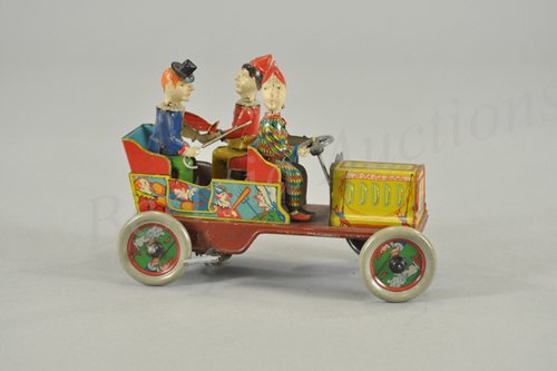 HANS EBERL "TA-RA-RA-BUMM" CLOWN CAR: Germany, c. 1920's, hand painted and lithographed tin, great graphic images surround tin open car with three seated clowns, each with hand painted head, one holds umbrella, one steers, and one holds c
