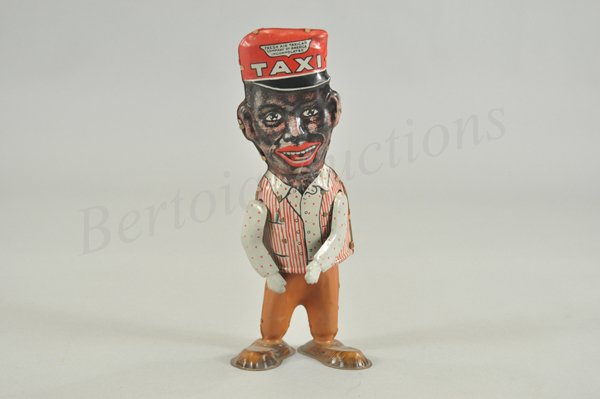 AMOS WALKER IN ORIGINAL BOX: Lithographed tin wind-up toy, working. Fixed eye variation. After the introduction of the moving eye toys in 1930, Louis Marx produced a less expensive toy that could be sold individually rather than 