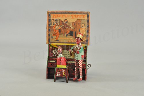 UNIQUE ART HOTT 'AN' TOTT RIGHT ON THE SPOT IN OR: Litho tin wind-up toy, working. Toy is identical to Strauss Ham and Sam with a paper label or decal placed over the name to create a new toy called Hott 'An' Tott. Probable that the Unique Art toy cam