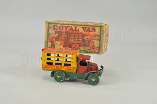 MARX ROYAL VAN TRUCK WITH ORIGINAL BOX: Lithographed tin, Mack cab done in red, yellow stake side enclosed body with opening doors, seated driver, key wind operated. 9 1/2" l.