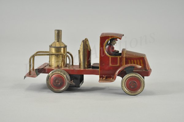 NIFTY FIRE PUMPER TRUCK: Lithographed tin, well detailed toy with open service body containing boiler and bell, 'C' Mack cab, seated driver, key wind driven, scarce example, this same frame design was used on several other Ni