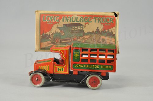 STRAUSS LONG HAULAGE TRUCK WITH ORIGINAL BOX: Lithographed tin, well detailed overall, done in red and green, enclosed cab and stake body with fold down gate, key wind operated, seated driver. 10 1/4" l.