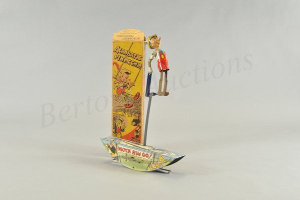 MARX PINOCCHIO ACROBAT IN ORIGINAL BOX: Litho tin wind up toy, working. Copyright dated 1939 Walt Disney Productions. The base is covered with multiple images of all of the storybook characters with whale on top. Marx substituted brown part
