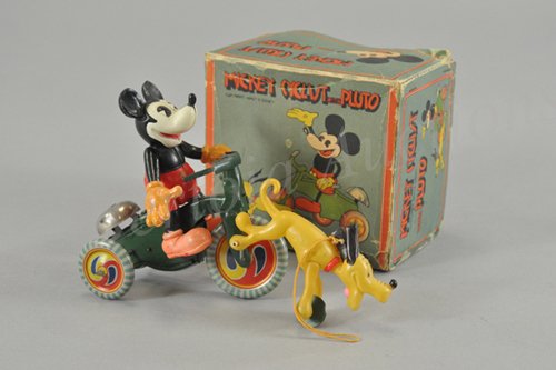 MICKEY MOUSE CYCLIST WITH RUNNING PLUTO IN ORIGIN: Celluloid figures and tin wind up toy, working. Japan 1930's. Copyright Walt E. Disney and distributed by Geo. Borgfeldt. Outstanding design has Mickey riding his tricycle with Pluto running alongside