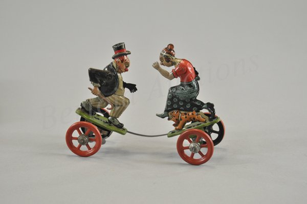 MAGGIE AND JIGGS FIGHTING IN ORIGINAL BOX: Litho tin wind up toy, working. Copyright dated 1924 George McManus and International Features Service. Nifty Brand, Geo. Borgfeldt distributor. Made in Germany possibly by Gunthermann. The epic battl