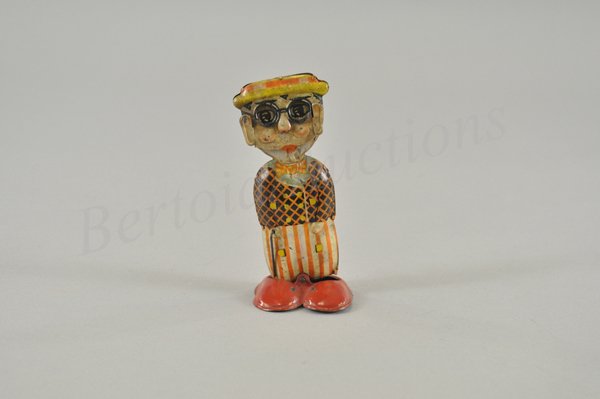 HAROLD LLOYD WADDLER: Litho tin wind up toy, working. Germany. Louis Marx copied and adapted this toy twice - first time to make the Funny Face walker that incorporated this toy's changing face action and the second time t