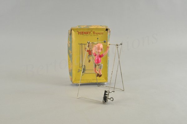 HENRY TRAPEZE IN ORIGINAL BOX: Celluloid wind up toy, working. Japan 1930s. 8 1/2" h.