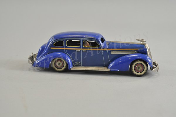 1936 PONTIAC SEDAN: Kuramochi, Japan, very rare clockwork sedan, large scale model, well detailed with extensive nickel trim, litho tin wheels, blue body has colorful orange and yellow striping, hood ornament and bumpers