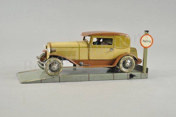 KARL BUB COUPE WITH PARKING SPACE: Germany, c.1932, auto sits on one lane parking space with sign, lithographed tin, done in light yellow body, brown roof and running boards, features electric lights, typical of 30's styled autos, seat