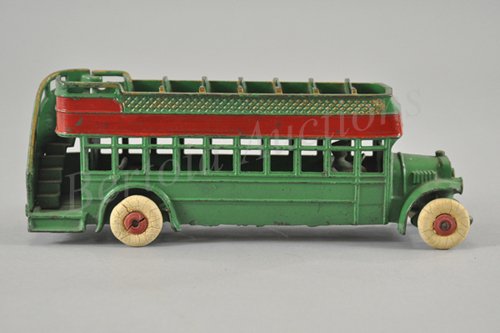 KENTON DOUBLE DECKER BUS: City bus example made for several years, painted in green body, red side band stripe, upper deck seating, railed stairway, seated driver, rubber tires. 11 1/4" l.