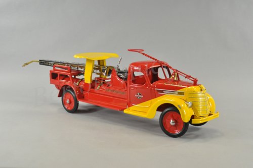 BUDDY "L" HYDRAULIC WATER TOWER: c. 1938, pressed steel, duo-tone slant colors of red and yellow, features enclosed cab, service body contains nickeled water tower, water tank, pull handle and seat, rubber tires. 34" l.