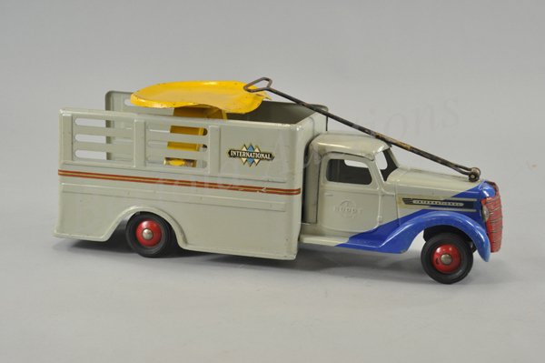 BUDDY "L" UTILITY DELIVERY TRUCK: c. 1940, pull and ride model, pressed steel, done in duo-tone slant design, blue and grey, slat side open body, decals read, "International," diamond logo pattern, decal on body, rubber tires. 22" l.