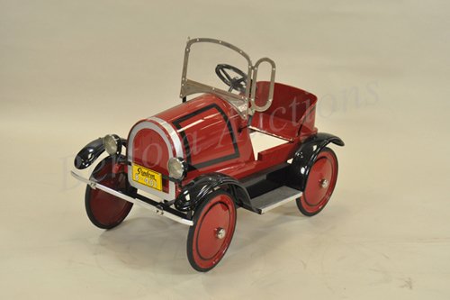 GENDRON ROADSTER PEDAL CAR: Pressed steel, painted in deep red overall, remanufactured parts, total restoration, black fenders, nickeled windshield, this auto is a recreation of an open roadster. 34" l.