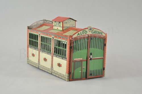 CHARLES ROSSIGNOL AUTO GARAGE: Early tin lithograph, quite elaborate toy auto garage features opening front bay doors, sides have die-cut window frames, very colorful overall, cupola adds nice touch to design. 15 1/4" d. x 7" w. x 