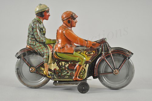 MOTORCYCLE WITH DRIVER AND PASSENGER: RSA, Spain, c. 1930's, lithographed tin, classic portrayal of couple riding cycle dressed in colorful outfits, clockwork mechanism, nice scale and detail, a very popular toy. 9 1/2" l.