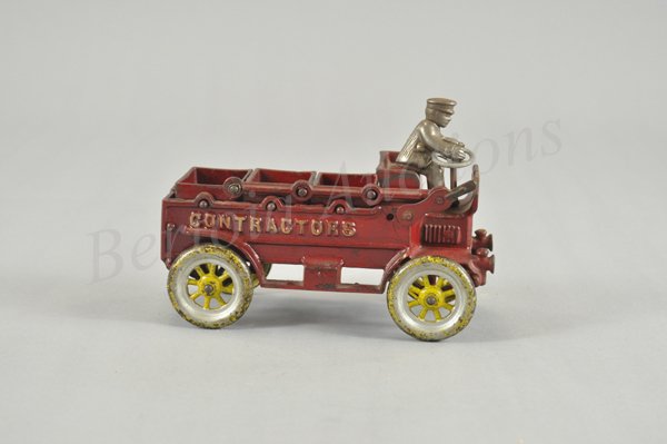 KENTON CONTRACTOR'S DUMP TRUCK: Cast iron, made for several years until 1931, painted in red with yellow and silver spoke wheels, features three activated dumping buckets, embossed sides. 8" l.