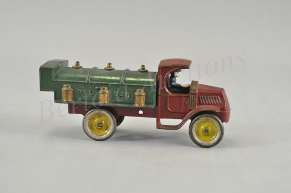 KENTON MACK OIL AND GAS TANK TRUCK: Late 1920's, cast iron, largest of this series, red "C" Mack cab, green tank body, embossed oil cans on sides, letters 'Oil & Gas' on sides, disc wheels, painted in yellow centers, seated driver. 11" 