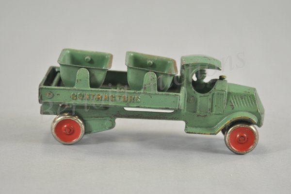 DENT BUCKET CONTRACTOR'S TRUCK: Cast iron Mack "C" cab with cast driver at window, features two tin tilting buckets, frame embossed 'Contractors,' nickeled disc wheels have painted red centers, very scarce example. 7 1/2" l.