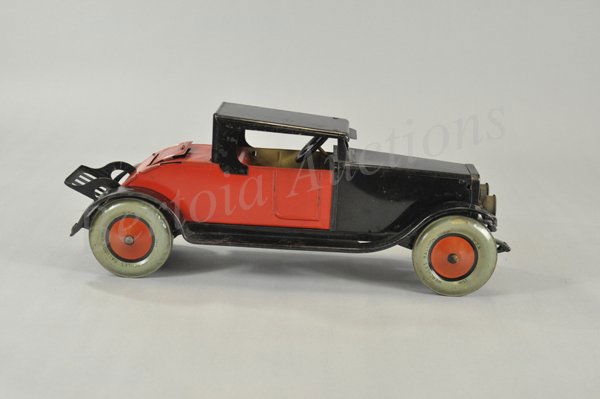 CHEIN 'HERCULES' COUPE: c. 1930's, large scale tin coupe with rumble seat, fold down luggage rack, done in red and black body, large balloon wheels. 17 1/2" l.