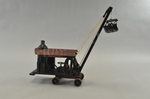 BUDDY "L" DREDGE: c. mid 1920's, scarce example, pressed steel steam type dredge with vertical boiler, housing contains hand steering boom with original clam shell, red corrugated roof, wheeled platform, decals on fram