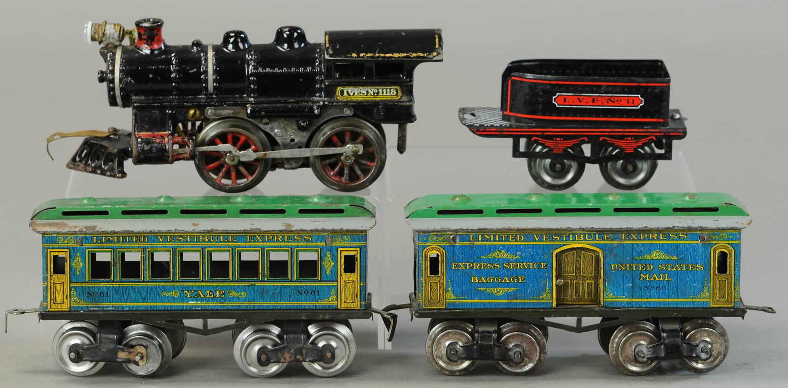 IVES NO. 1118 LOCO AND YALE CAR: 15. IVES NO. 1118 LOCO AND YALE CAR | 0 Gauge, electric. Loco 7" l. | Tender is replaced, otherwise in All Original Condition. | $300 - $600