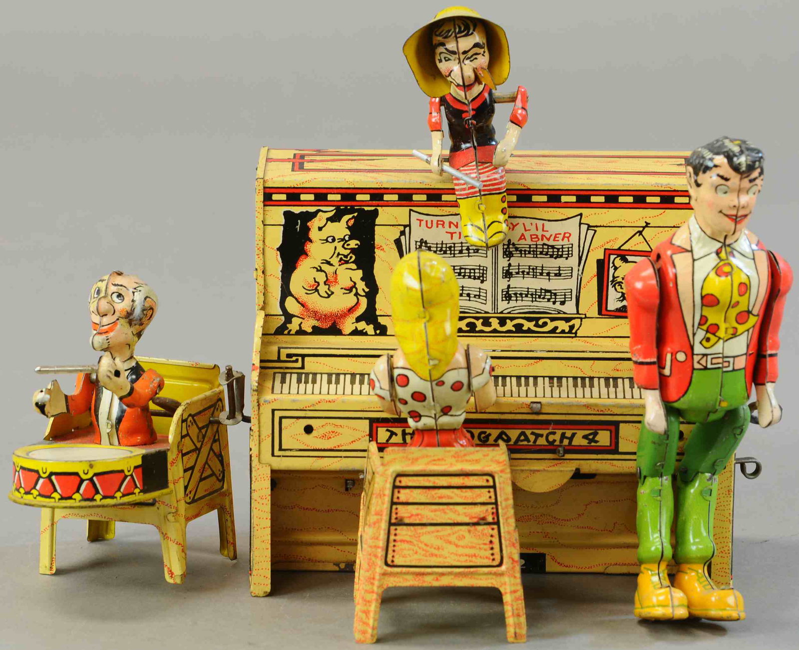 UNIQUE ART LIL ABNER DOGPATCH BAND: 134. UNIQUE ART LIL ABNER DOGPATCH BAND | 10" l. | Mammy's arms are replaced, pappy has some touch-up to head and drumsticks are glued to hands, working in otherwise Original Condition. | $200 - $400