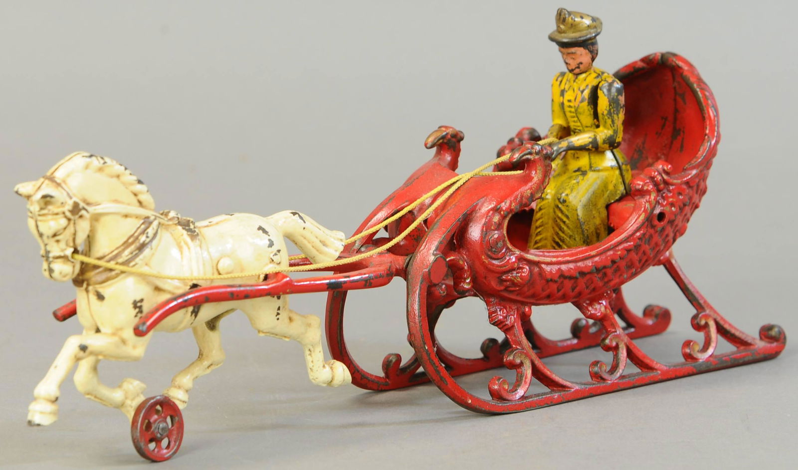 HUBLEY HORSE DRAWN SLEIGH: 285. HUBLEY HORSE DRAWN SLEIGH | 14.5" l. | Restored, incorrect figure. | $150 - $300