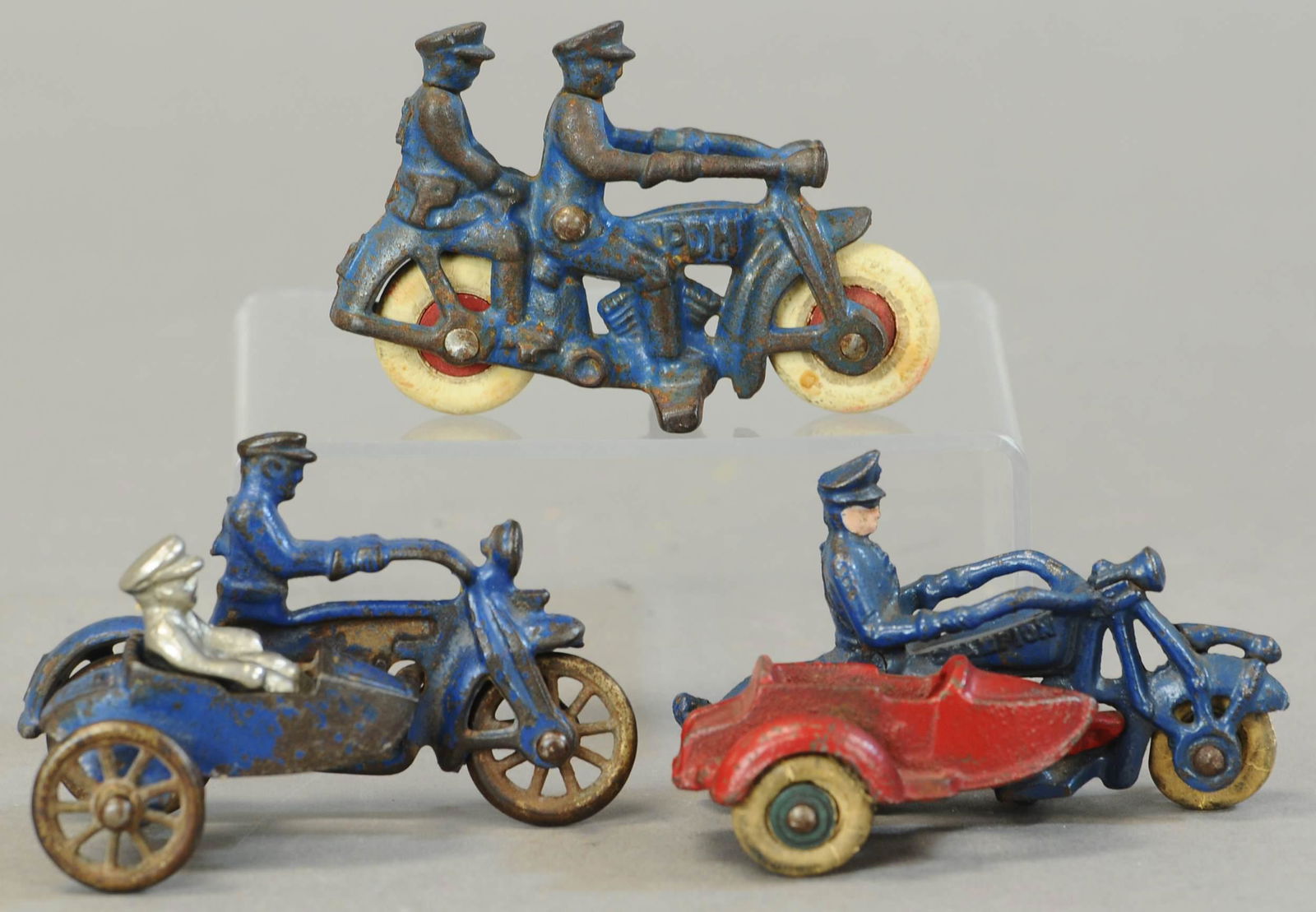 THREE SMALL CAST IRON CYCLES (1 of 4)