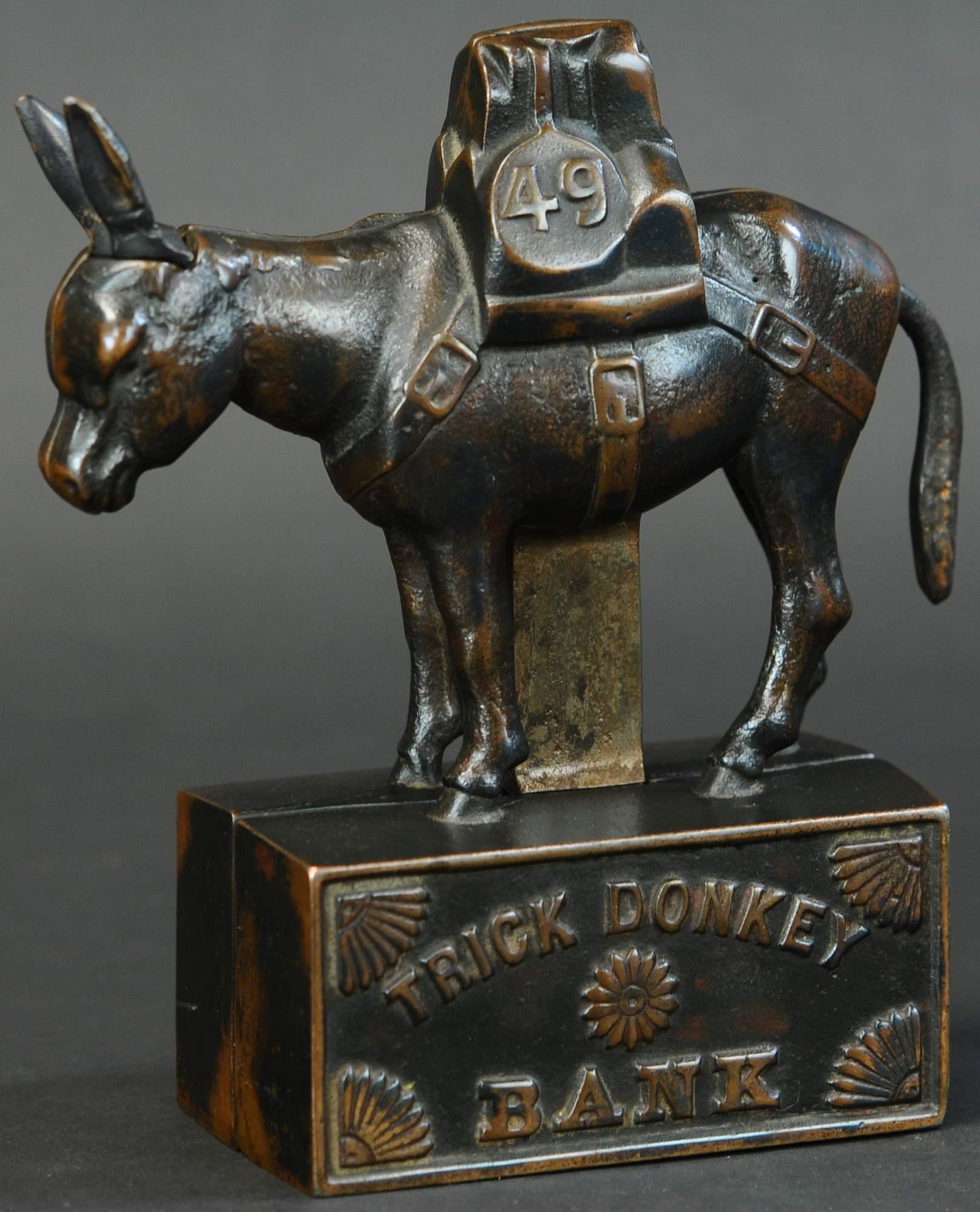 TRICK DONKEY MECHANICAL BANK: 617. TRICK DONKEY MECHANICAL BANK | A rare bank of which the maker is unknown and only a handful are known to exist, has the impeccable casting the likes of Ives, has patented date on base 1897, japan