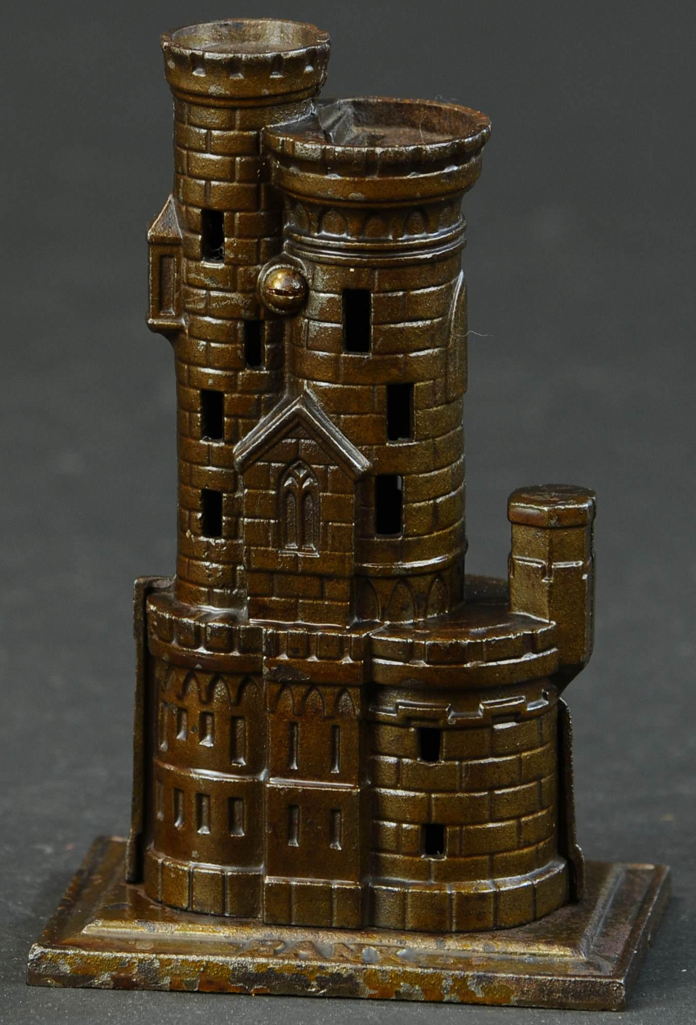 HARPER CASTLE W/ TOWERS STILL BANK: 639. HARPER CASTLE W/ TOWERS STILL BANK | Provenance: The Schroeder Collection. | 7" h. | (Excellent to Pristine Condition) | $300 - $500