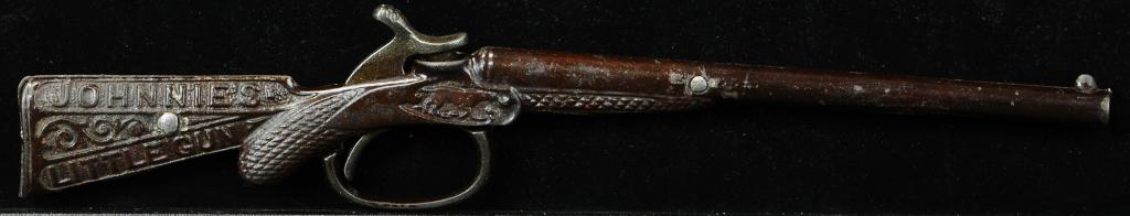 JOHNNYS LITTLE GUN CAP PISTOL: 898. JOHNNYS LITTLE GUN CAP PISTOL | Provenance: The Schroeder Collection. | 11" l. | Hammer/trigger is original, repair to stock of gun, otherwise (Excellent Condition) | $600 - $900