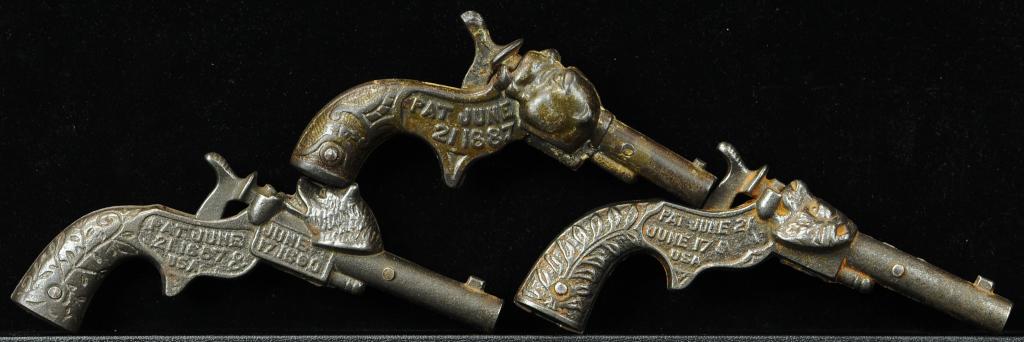 THREE FIGURAL CAP PISTOLS: 921. THREE FIGURAL CAP PISTOLS | Bulldog, lion, and Frontier. Provenance: The Schroeder Collection. | 5"- 6" l. | (Very Good to Excellent Condition) | $400 - $600