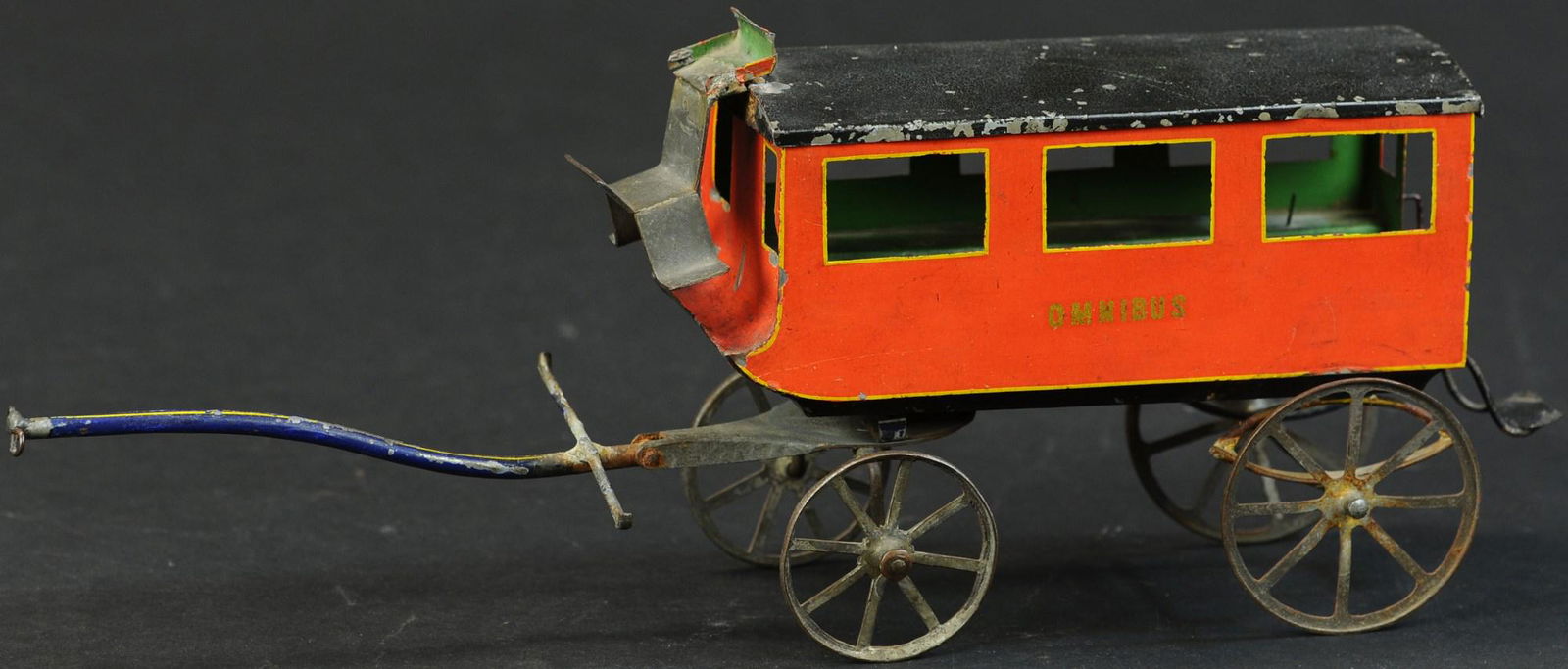 HAND PAINTED FRENCH OMNIBUS: 1065. HAND PAINTED FRENCH OMNIBUS | France, circa 1890, horse drawn omnibus, stamped-tin wheels, hinged roof opens so passengers can be placed on two benches running the length of the coach. Provenanc