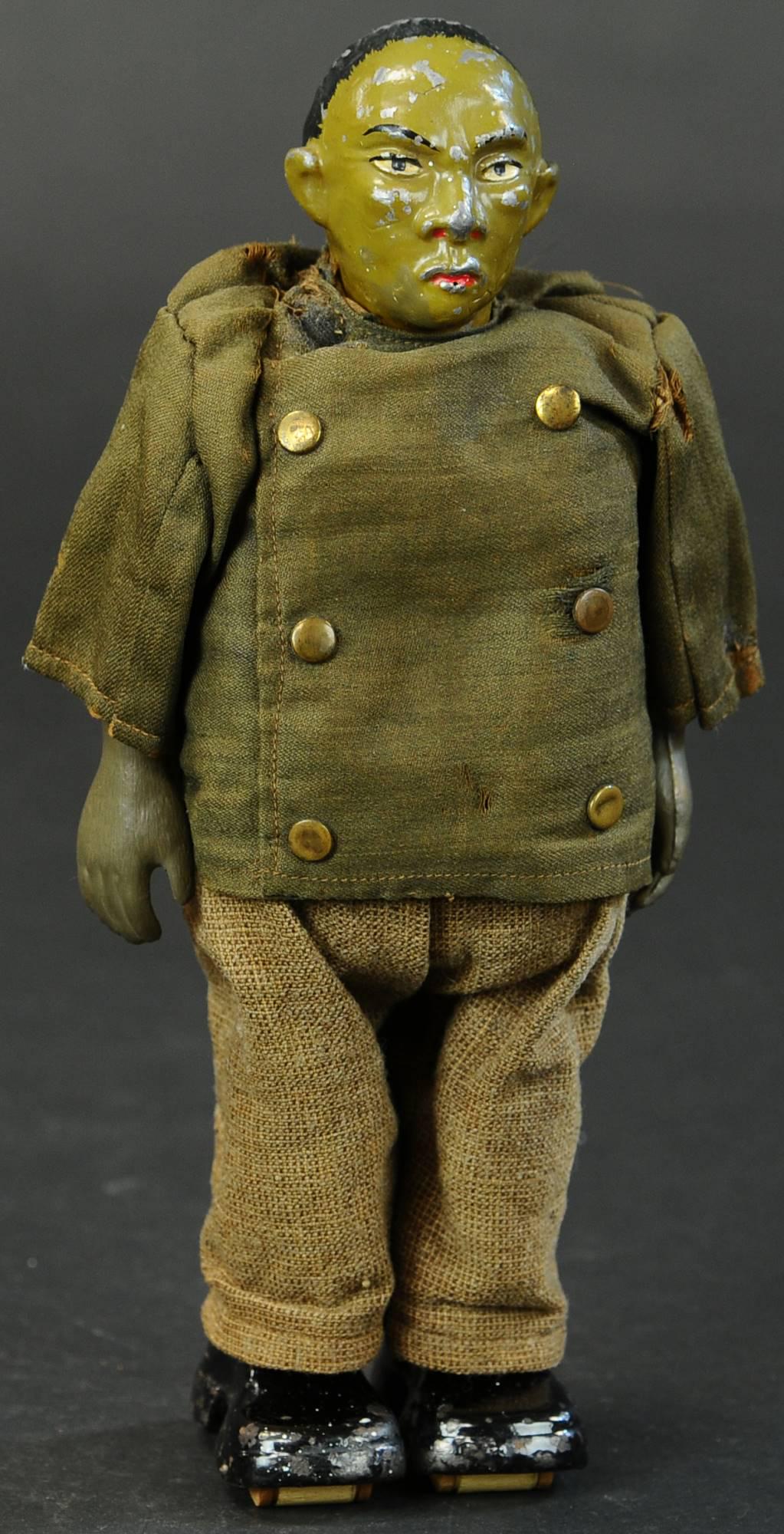 IVES CHINAMAN WALKER: 1262. IVES CHINAMAN WALKER | Rare and desirable figure, clockwork activated, one of the fabulous early series of walking figures. Provenance: Leon Perelman. Provenance: The Schroeder Collection. | 9.5