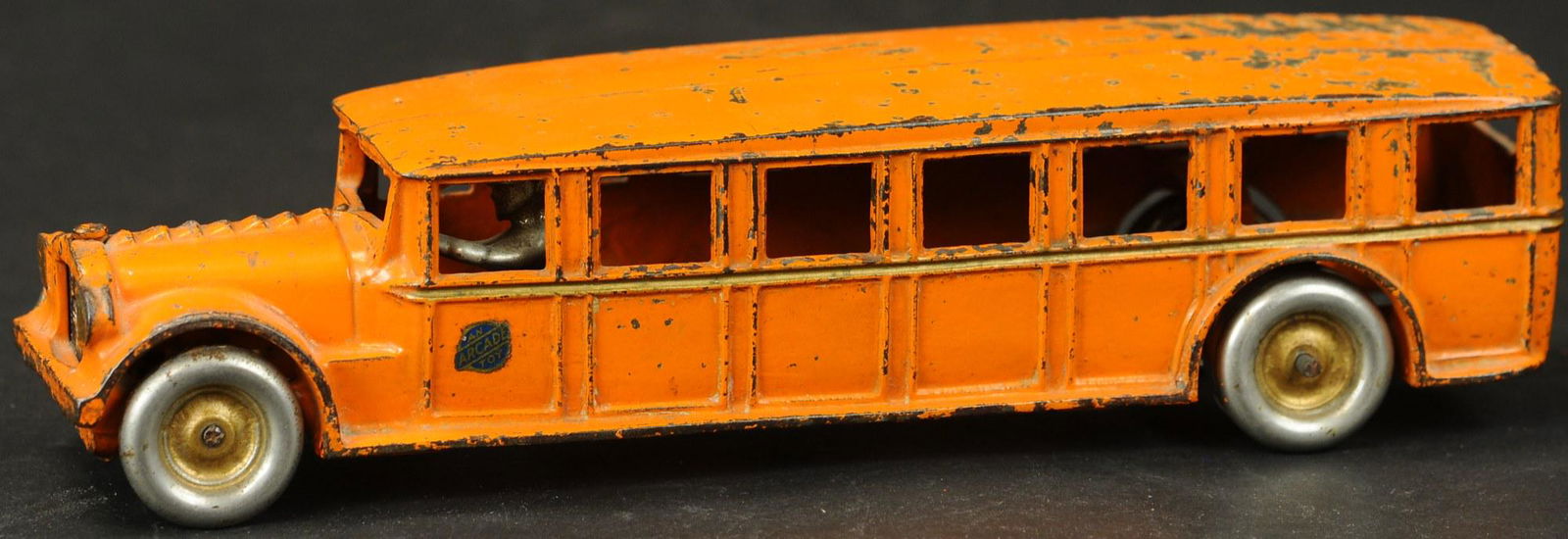 ARCADE FAGEOL SAFETY COACH: 1168. ARCADE FAGEOL SAFETY COACH | Harder to find in orange. | 12" l. | Provenance: Paul Cole Collection. | (Very Good to Excellent Condition) | $300 - $500