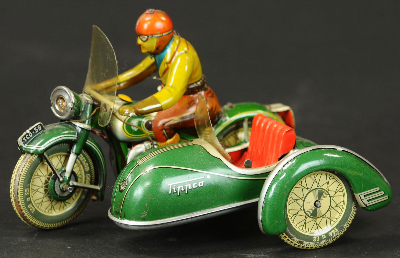 TIPPCO MOTORCYCLE WITH SIDECAR: 66. TIPPCO MOTORCYCLE WITH SIDECAR | Working. | 8" l. | (Exc. Cond.) | $600 - $900