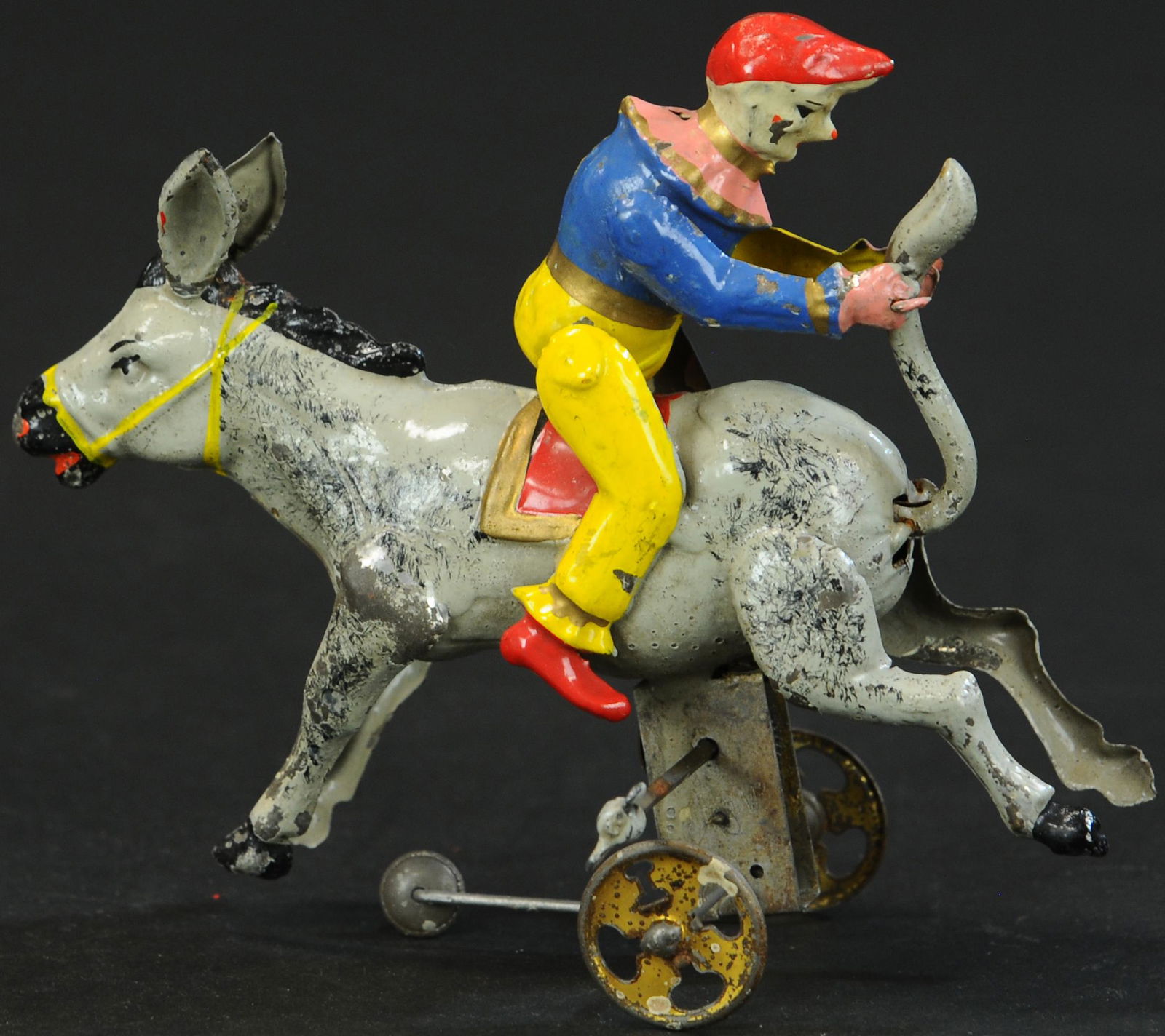 HANS EBERL TIN CLOWN PULLING DONKEY TAIL (1 of 4)