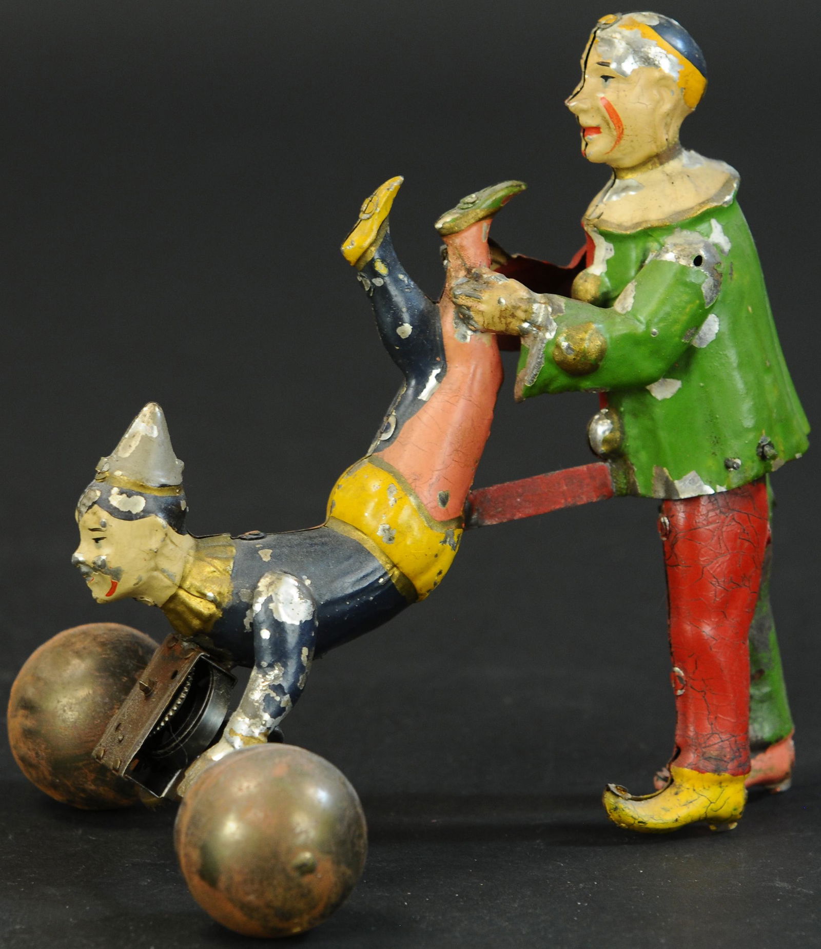 HANS EBERL CLOWN WHEELBARROW TOY: 75. HANS EBERL CLOWN WHEELBARROW TOY | 7.5" h. | A couple spots of re-solder, paint all original in (Exc. Cond.) for age. | $2,000 - $4,000