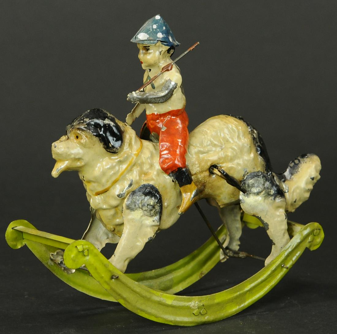 MANGOLD SOLDIER BOY ON DOG ROCKER: 77. MANGOLD SOLDIER BOY ON DOG ROCKER | Germany, attributed to Mangold. | 7.5" l. | Resolder and some touch-up at legs, original paint has been clear coated to prevent flaking, (Exc. Cond.) | $600 - $