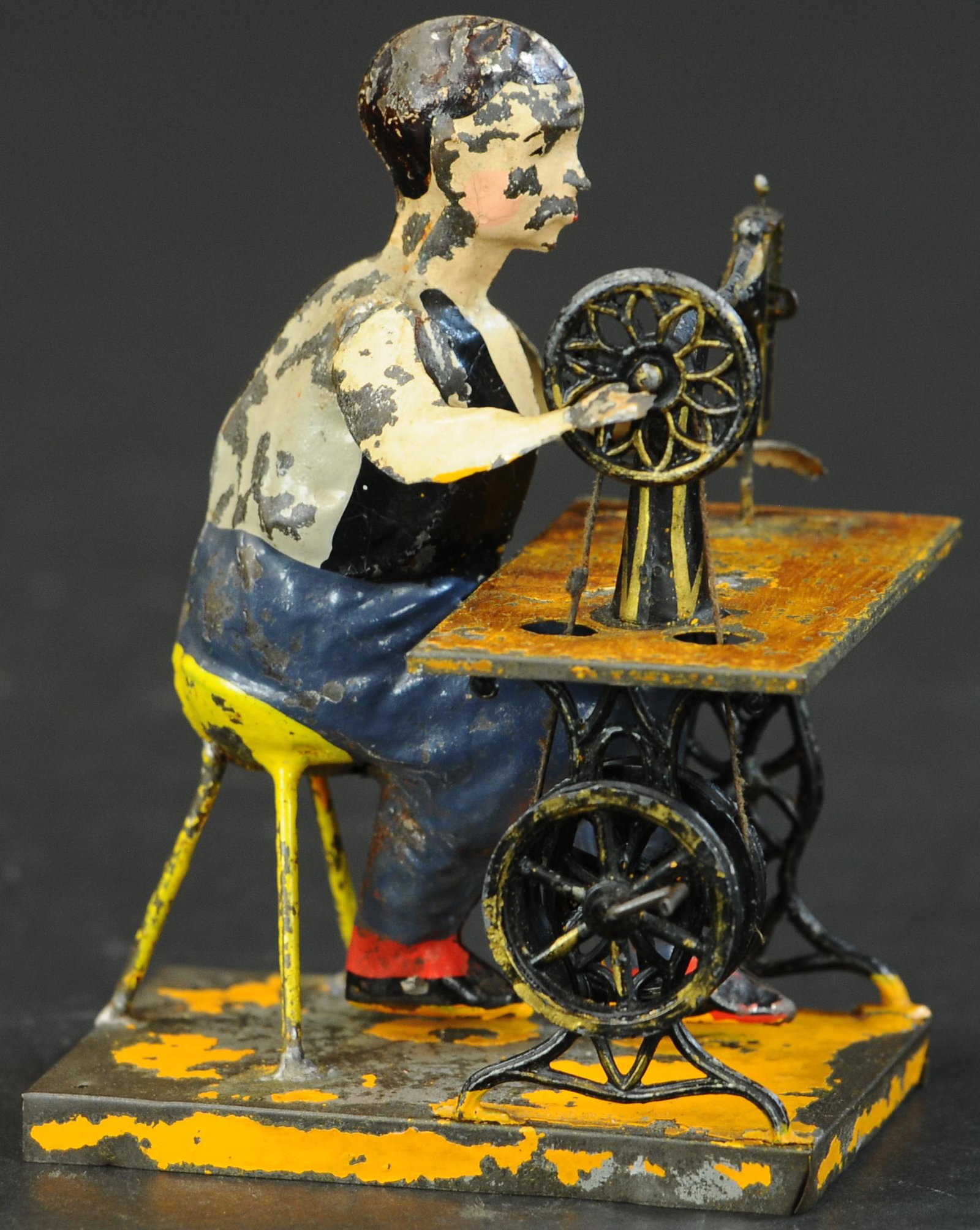 BING MAN AT SEWING MACHINE: 179. BING MAN AT SEWING MACHINE | 6" h. | Minor resolder, overall (Very Good Cond.) | $600 - $900