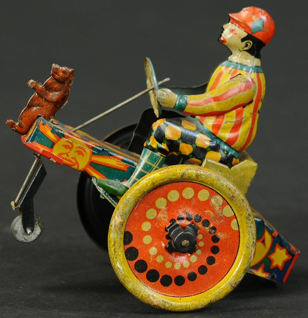 CKO CLOWN CART: 326. CKO CLOWN CART | Working. | 5" l. | Flag held by bear is missing, otherwise in (VG - Exc. Cond.) | $400 - $600